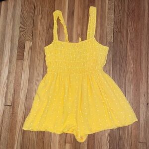 Urban outfitters yellow romper, white polka dots.    Never worn!